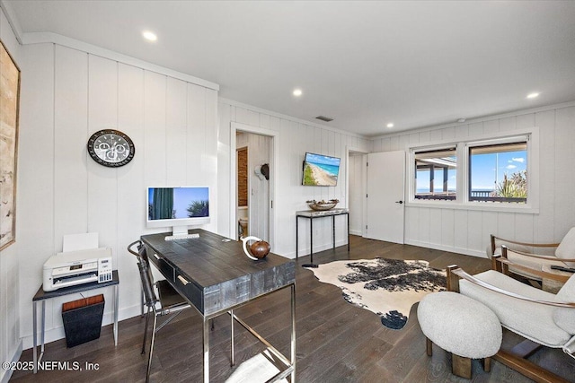 home office with dark hardwood / wood-style flooring and ornamental molding