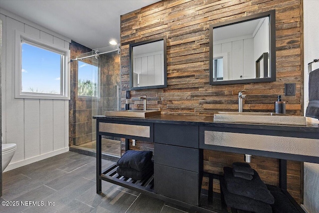 bathroom with toilet, hardwood / wood-style floors, vanity, and a shower with shower door