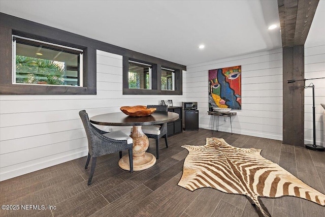 dining area with dark hardwood / wood-style floors