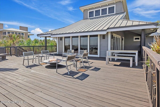 deck featuring a fire pit