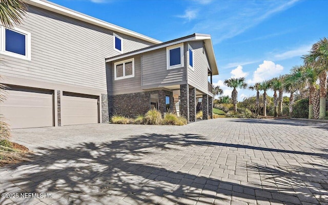 view of side of property featuring a garage