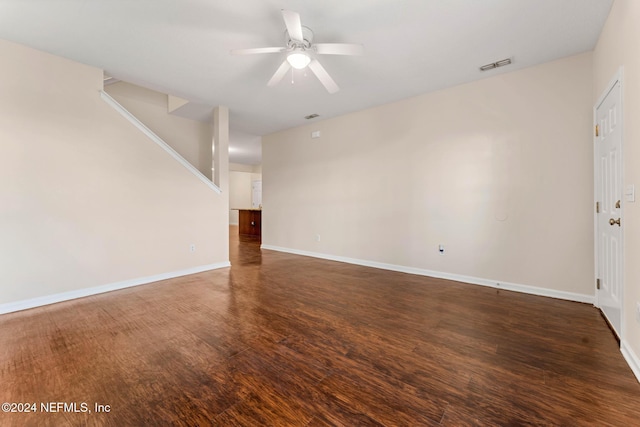 unfurnished room featuring dark hardwood / wood-style floors and ceiling fan