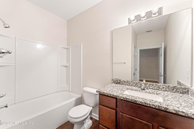 full bathroom with shower / tub combination, hardwood / wood-style floors, vanity, and toilet