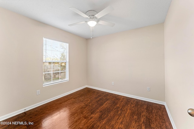 empty room featuring ceiling fan and wood-type flooring