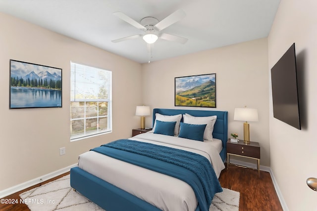 bedroom with ceiling fan and dark hardwood / wood-style floors