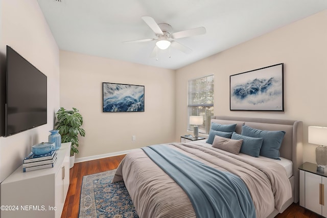 bedroom featuring ceiling fan and dark hardwood / wood-style flooring