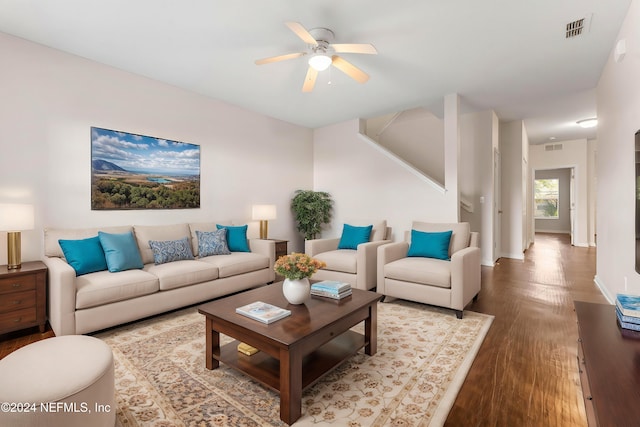 living room featuring hardwood / wood-style flooring and ceiling fan