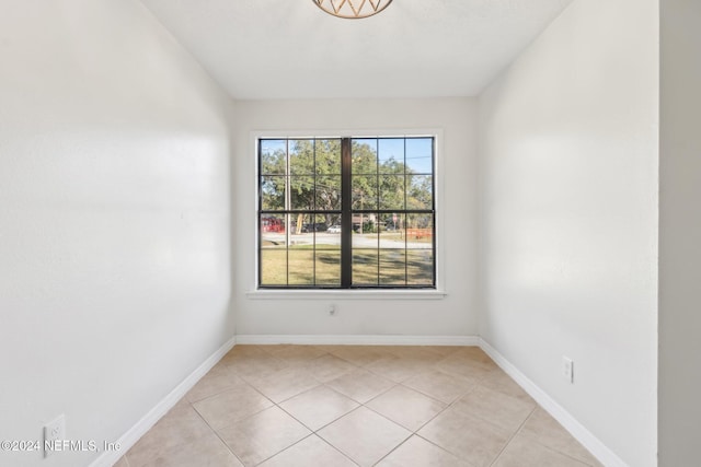 empty room featuring light tile patterned floors