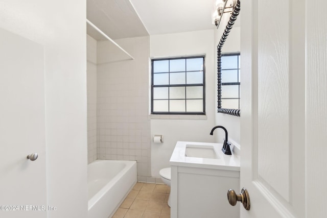 full bathroom with tile patterned flooring, vanity, toilet, and tiled shower / bath combo