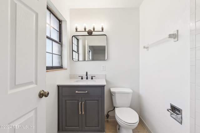 bathroom with tile patterned floors, vanity, and toilet