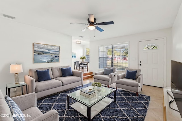 tiled living room featuring ceiling fan