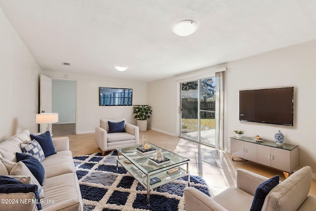 living room with light tile patterned floors