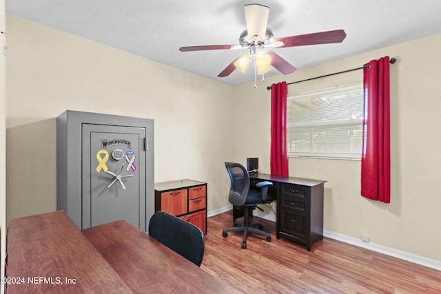 office with ceiling fan and light hardwood / wood-style floors