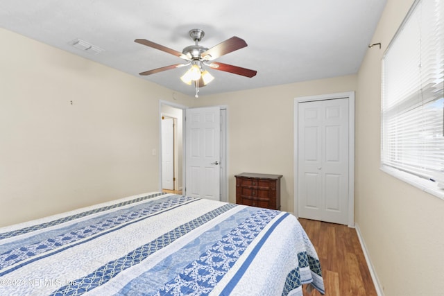 bedroom featuring hardwood / wood-style floors and ceiling fan