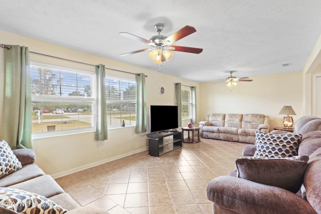 living room featuring light tile patterned floors and a textured ceiling