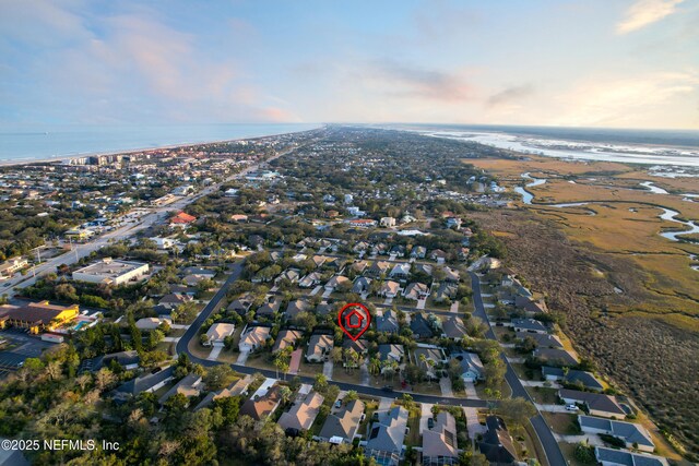 bird's eye view featuring a view of the beach and a water view