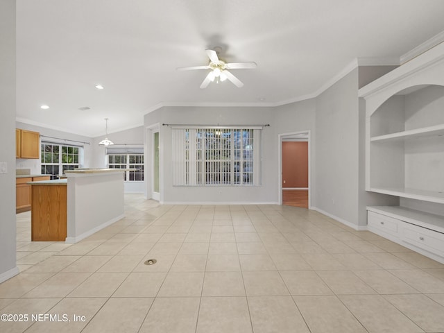 unfurnished living room featuring light tile patterned floors, ceiling fan, and built in shelves