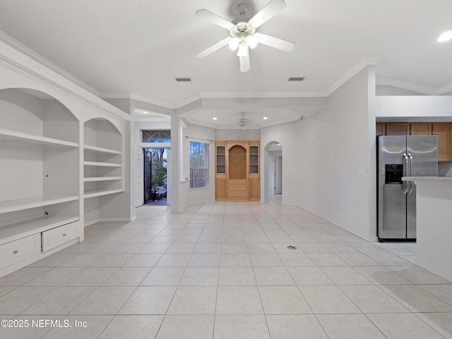 unfurnished living room with crown molding, light tile patterned floors, built in features, and ceiling fan