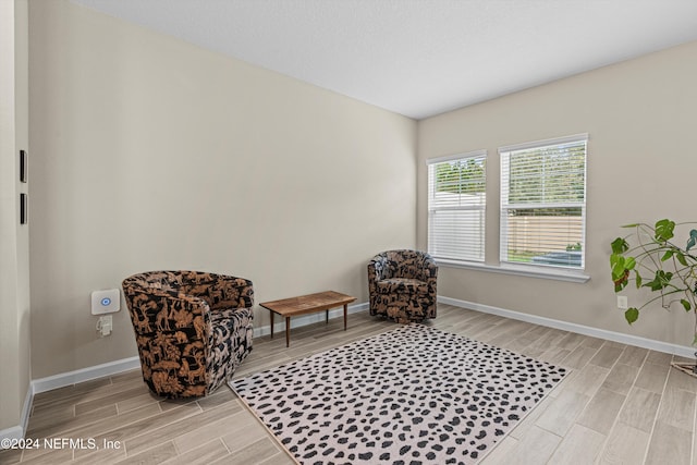 sitting room with light wood-type flooring