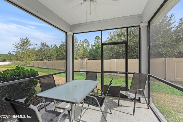 sunroom featuring plenty of natural light and ceiling fan