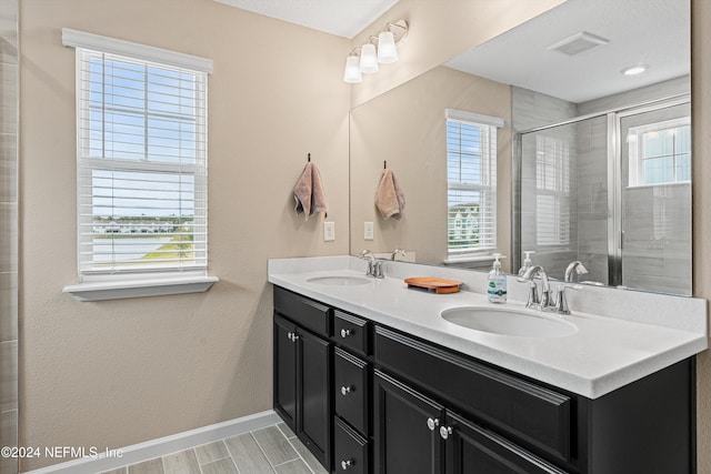 bathroom with vanity and an enclosed shower