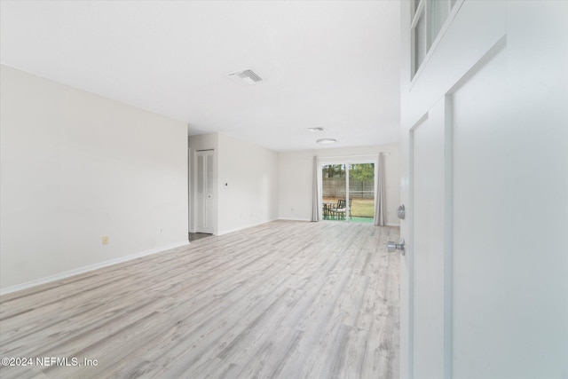 spare room with light hardwood / wood-style floors