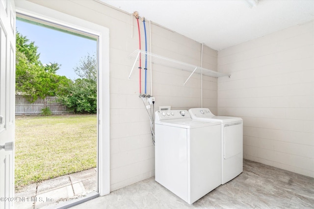 washroom featuring washer and clothes dryer