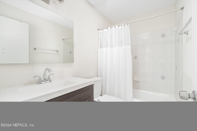 full bathroom with vanity, shower / bath combination with curtain, and toilet