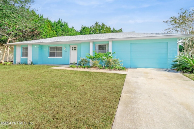 ranch-style house with a front lawn and a garage