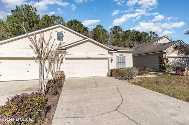 ranch-style home featuring a garage