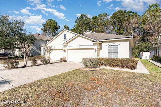 view of front of house featuring a front yard and a garage