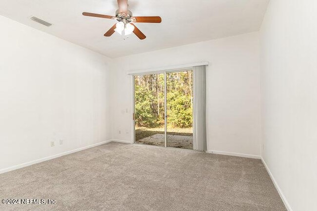 empty room with light colored carpet and ceiling fan