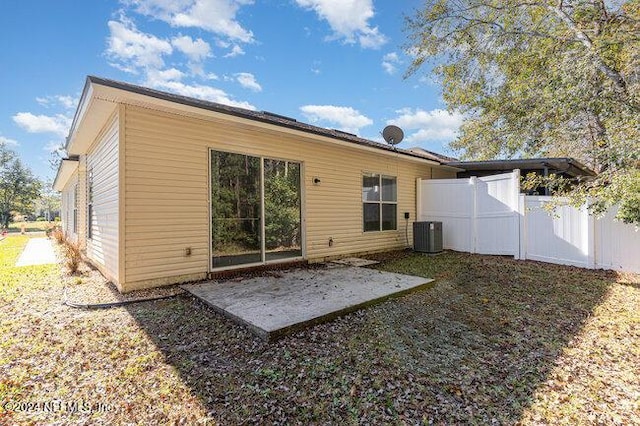 back of house featuring central air condition unit and a patio area