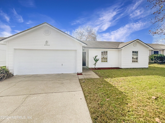 single story home with a garage and a front yard