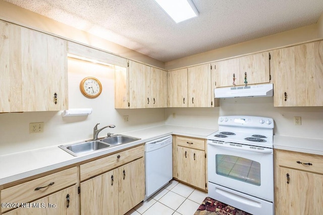 kitchen featuring a textured ceiling, white appliances, sink, light tile patterned floors, and light brown cabinets