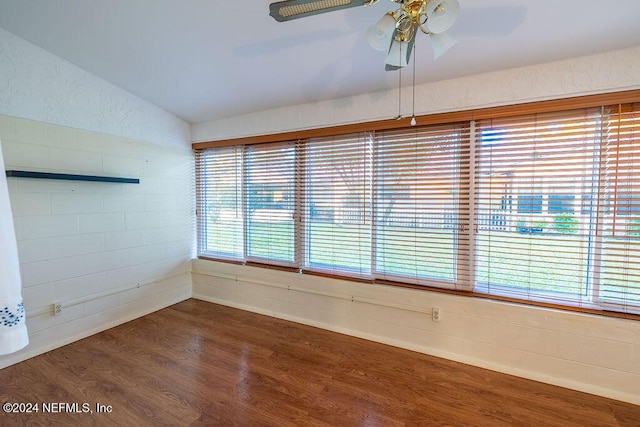 spare room featuring ceiling fan, vaulted ceiling, and hardwood / wood-style flooring