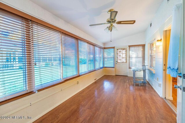 interior space featuring hardwood / wood-style floors, ceiling fan, and lofted ceiling