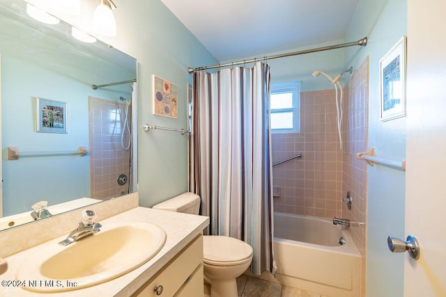 full bathroom featuring tile patterned floors, shower / bath combination with curtain, toilet, and vanity