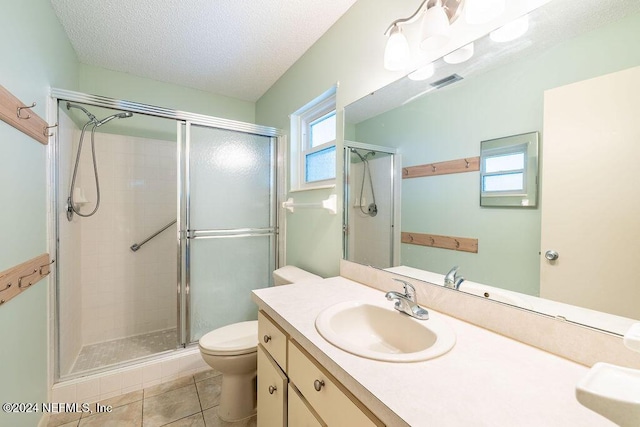 bathroom with tile patterned floors, plenty of natural light, and an enclosed shower