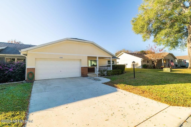 ranch-style home with a garage, a porch, and a front yard