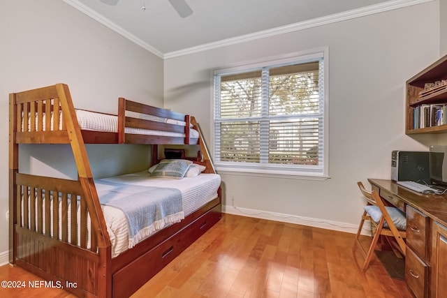 bedroom featuring ceiling fan, light hardwood / wood-style flooring, and ornamental molding