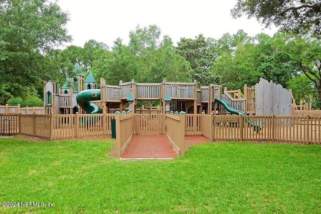 view of jungle gym featuring a lawn