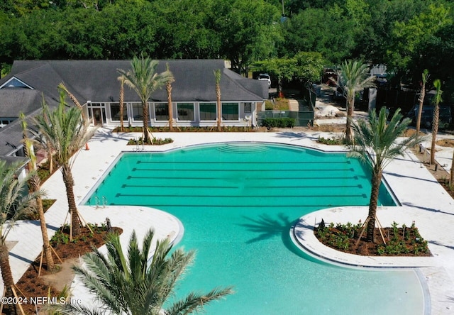 view of swimming pool with a patio area