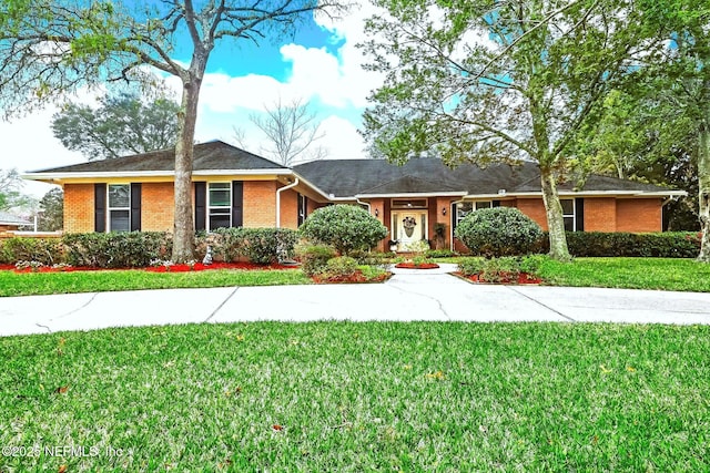 ranch-style house with a front yard