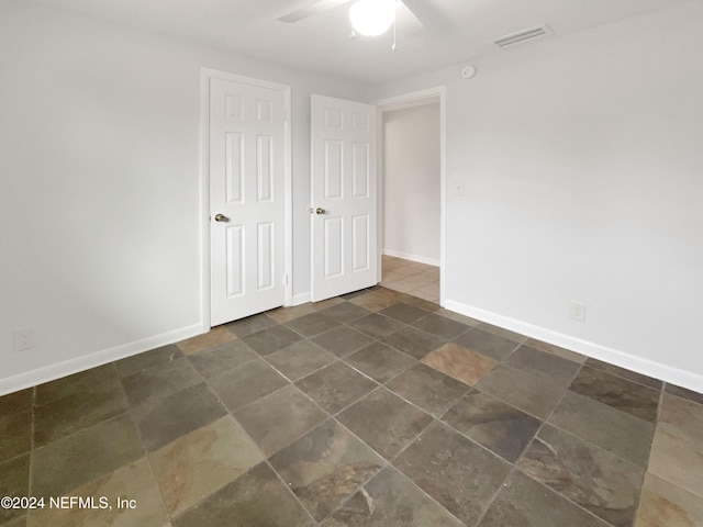 spare room featuring ceiling fan