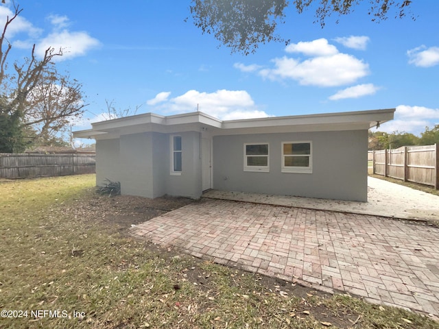 rear view of house featuring a patio area