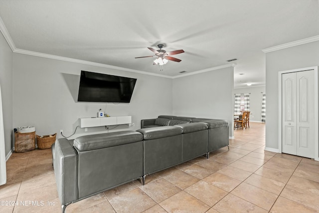 tiled living room featuring ornamental molding and ceiling fan