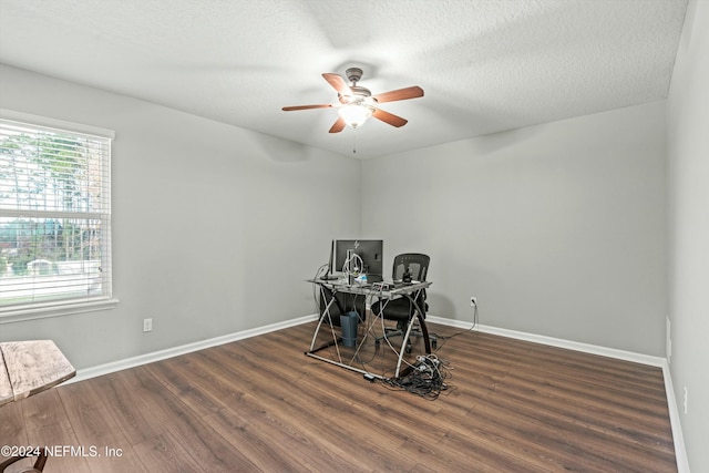 office with ceiling fan, dark hardwood / wood-style flooring, and a textured ceiling