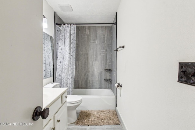 full bathroom featuring tile patterned flooring, vanity, shower / bath combo, and toilet