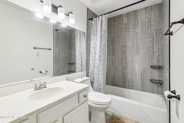 full bathroom featuring shower / tub combo, vanity, and toilet